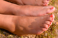 pale bare feet that rarely see the light of day